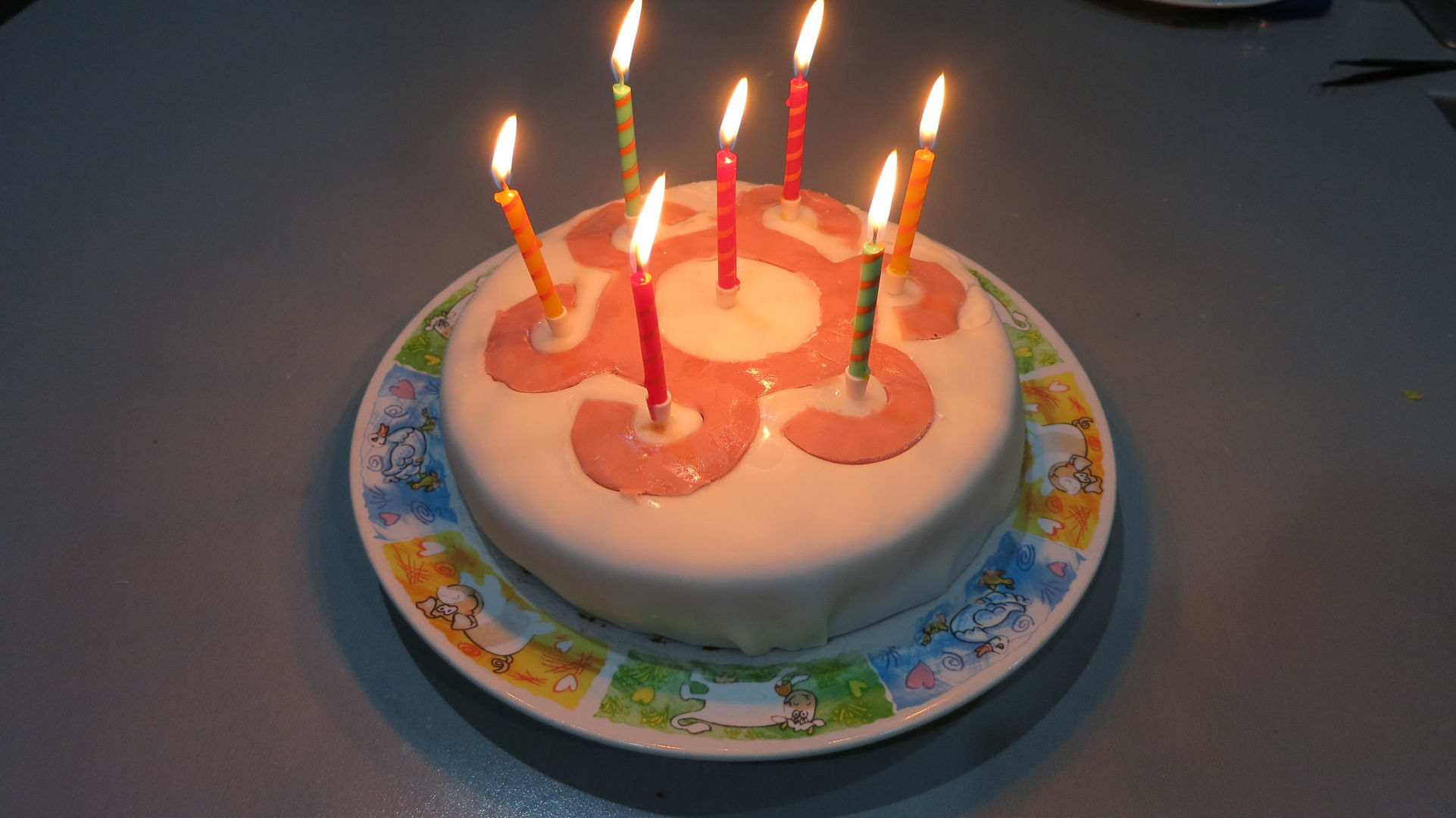 A picture of a cake with candles.