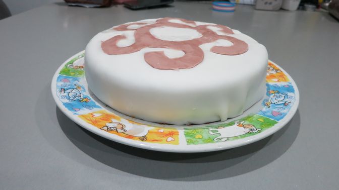 A picture of a cake which has been decorated.